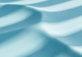Smooth, light blue surface with flowing, wave-like patterns, creating a textured Royalty Free Stock Photo