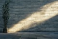 A smooth, light gray brick wall with even surfaces, illuminated by soft, ambient lighting for a Royalty Free Stock Photo