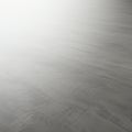 Smooth, light gray concrete surface with subtle texture and faint lines. The gradient o Royalty Free Stock Photo