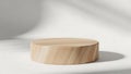Minimalist wooden cylinder on plain white surface casting soft shadow in natural light setting Royalty Free Stock Photo