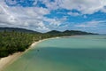 Aerial view of palm beach with turquoise water and blue cloudy sky Royalty Free Stock Photo