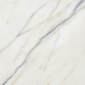 Smooth marble surface featuring a white base with light gray and brown veining Royalty Free Stock Photo