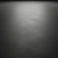 A smooth, monochromatic gray surface stretches across the image, displaying subtle Royalty Free Stock Photo