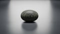 Setting emphasizes the pebble s natural shape and subtle color Royalty Free Stock Photo