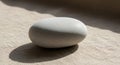 A smooth, oval pebble rests on Royalty Free Stock Photo