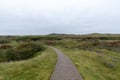 Smooth pathway in the countryside terrain, the picturesque nature of Borkum island