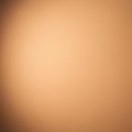 Smooth, peach-colored wall with subtle light and shadow variations. Minimal texture is Royalty Free Stock Photo