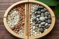 smooth pebbles arranged in a circle inside a bamboo tray