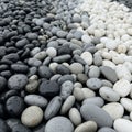 Pebbles arranged in a gradient from black to white create a visual Royalty Free Stock Photo