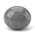 Smooth, polished grey stone sphere with a glossy surface reflecting light. The stone has Royalty Free Stock Photo