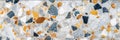 Smooth polished terrazzo surface with a mix of white, gray, and orange stones. This modern texture is ideal for backgrounds in Royalty Free Stock Photo