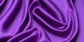 These smooth purple satin fabrics embody elegance with their luxurious texture and rich hue.