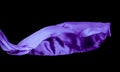 Smooth purple transparent cloth isolated on black background