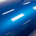 A smooth, reflective blue surface with a glossy finish, featuring bright rectangular highlights. Royalty Free Stock Photo