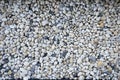 Smooth round pebbles texture background. Pebble sea beach close-up, dark wet pebble and gray dry pebble