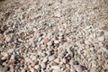 Smooth round pebbles texture background. Pebble sea beach close-up, white, brown and gray dry pebble. Small round stones Royalty Free Stock Photo