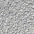 Smooth, round pebbles in various sizes cover the surface, closely packed together. The stones are Royalty Free Stock Photo