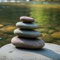 Smooth, rounded stones in ascending order of size rests on a Royalty Free Stock Photo