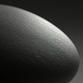 Smooth, rounded surface resembling a stone or pebble, predominantly gray with Royalty Free Stock Photo