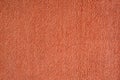 Smooth seamless texture of a terry towel. Coral color