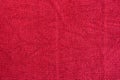 Smooth seamless texture of a terry towel. Red color