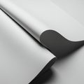 Smooth sheets of white paper, elegantly curled, create an abstract composition. The Royalty Free Stock Photo