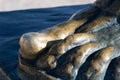 Smooth and shiny toe of a bronze statue