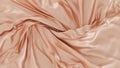 smooth silky fabric orange rose color. Beautiful soft crumpled texture. For luxury display, cosmetic