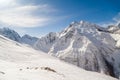 Smooth ski slopes of the Caucasus Mountains on a sunny winter day Royalty Free Stock Photo