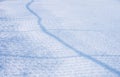 The shadow of the fence on flat snow Royalty Free Stock Photo