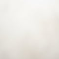 A smooth, soft background featuring a warm, light beige color gradient. The image has no distinct Royalty Free Stock Photo