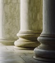 Smooth stone columns with light shining on them Royalty Free Stock Photo
