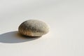 Smooth stone on a minimalist background Royalty Free Stock Photo