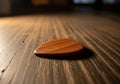 Wood grain of both the object and the surface is visible, creating a Royalty Free Stock Photo