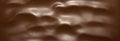 Chocolate photo background.Smooth texture of milk chocolate.