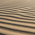 Smooth texture of the sand, creating a pattern of light and shadow Royalty Free Stock Photo