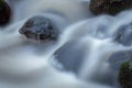 Smooth Water Flowing Over Rock in the Glencullen River Royalty Free Stock Photo