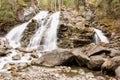 Smooth Waterfall in Forest Over Rocks Royalty Free Stock Photo