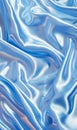 Smooth waves of a blue silky fabric with a fluid abstract design and soft highlights giving a sense of movement.