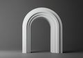 A smooth, white arc structure stands against a dark gray Royalty Free Stock Photo