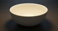 A smooth, white ceramic bowl sits Royalty Free Stock Photo