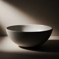 A smooth, white ceramic bowl is Royalty Free Stock Photo