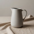 A smooth, white ceramic pitcher with Royalty Free Stock Photo