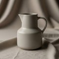 Smooth white ceramic pitcher with a Royalty Free Stock Photo