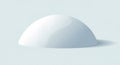 A smooth, white, hemispherical object sits Royalty Free Stock Photo