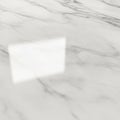 Smooth white marble surface with subtle gray veining, showing a soft, rectangular Royalty Free Stock Photo
