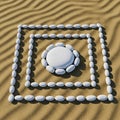 Smooth white pebbles are arranged on a textured sandy surface, forming geometric patterns. Three Royalty Free Stock Photo