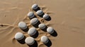 Minimalist beach view with smooth white stones arranged on the sand Royalty Free Stock Photo