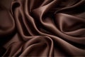 Smooth wrinkled silk bedsheet, fabric background. Abstract crumpled satin texture. Dark brown color. Folded cloth, wallpaper. Soft