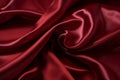 Smooth wrinkled silk bedsheet, fabric background. Abstract crumpled satin texture. Dark red color. Folded cloth, wallpaper. Soft Royalty Free Stock Photo